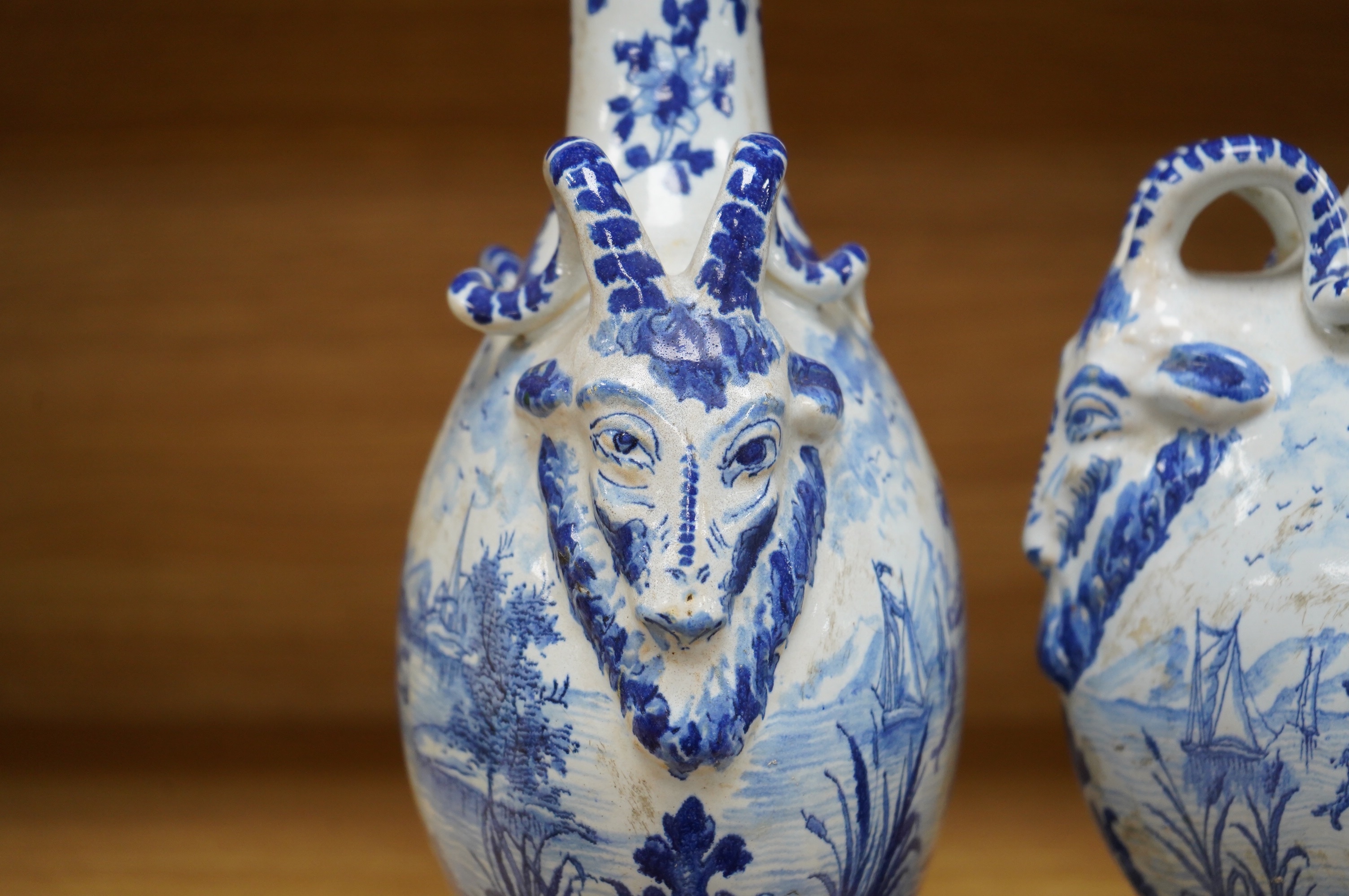 A pair of mid 18th century Delft blue and white flagons